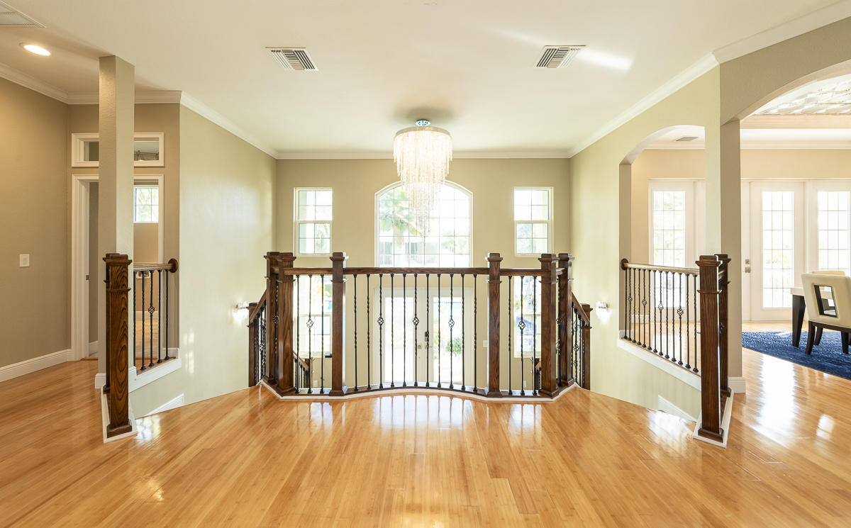 2 Go Lane Key West, FL 33040 - Photo 5 of 42 a view of a room with wooden floor windows and a chandelier