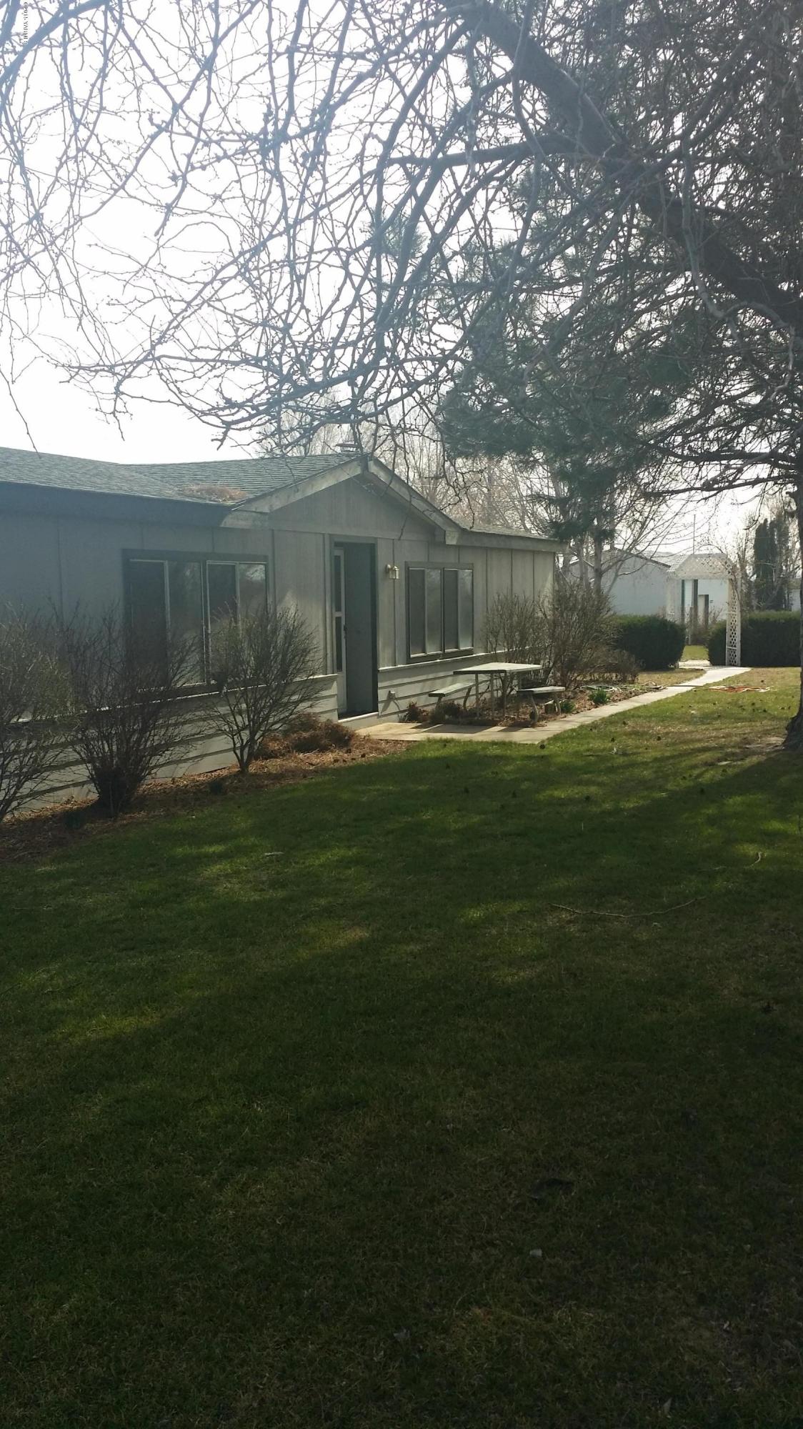 2861 Independence Road Outlook, WA 98938 - Photo 2 of 35 a backyard of a house with table and chairs