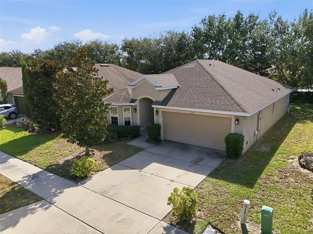 a view of house with yard
