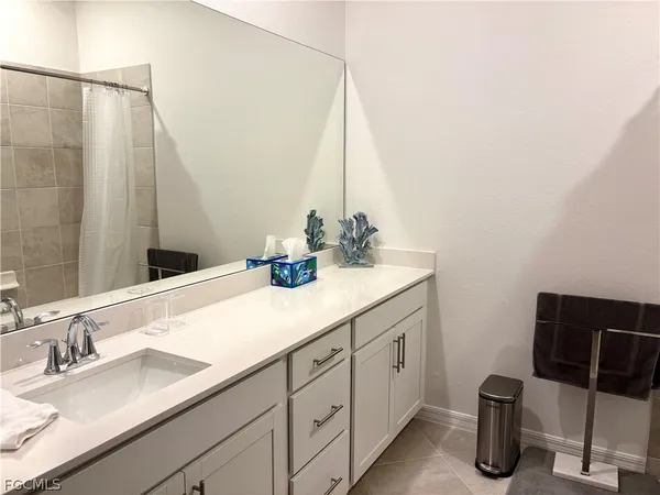 a bathroom with a double vanity sink