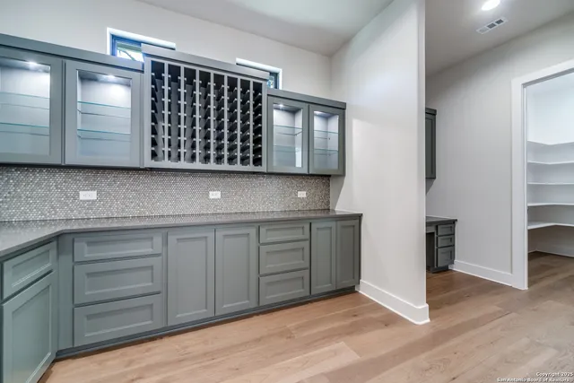 a view of kitchen with furniture and wooden floor