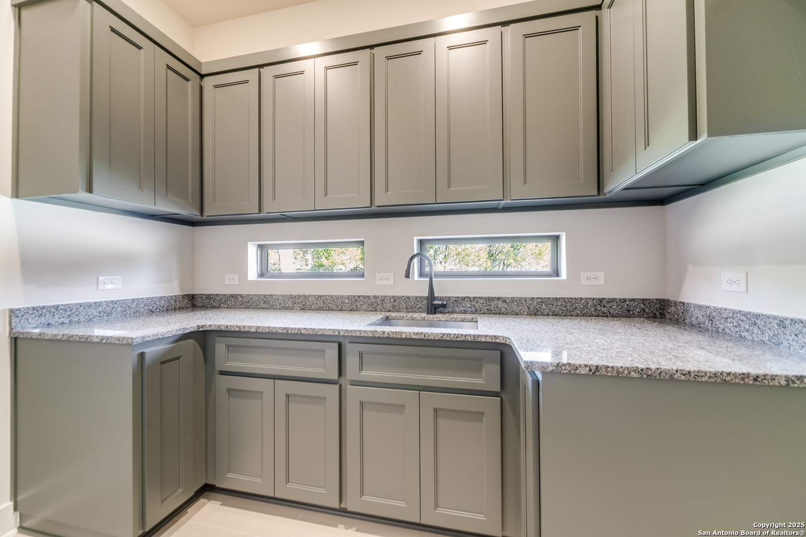 193 Ranch Heights Boerne, TX 78015 - Photo 13 of 29 a kitchen with granite countertop a sink a stove and cabinets