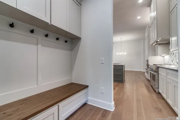 a bathroom with a tub a sink and mirror