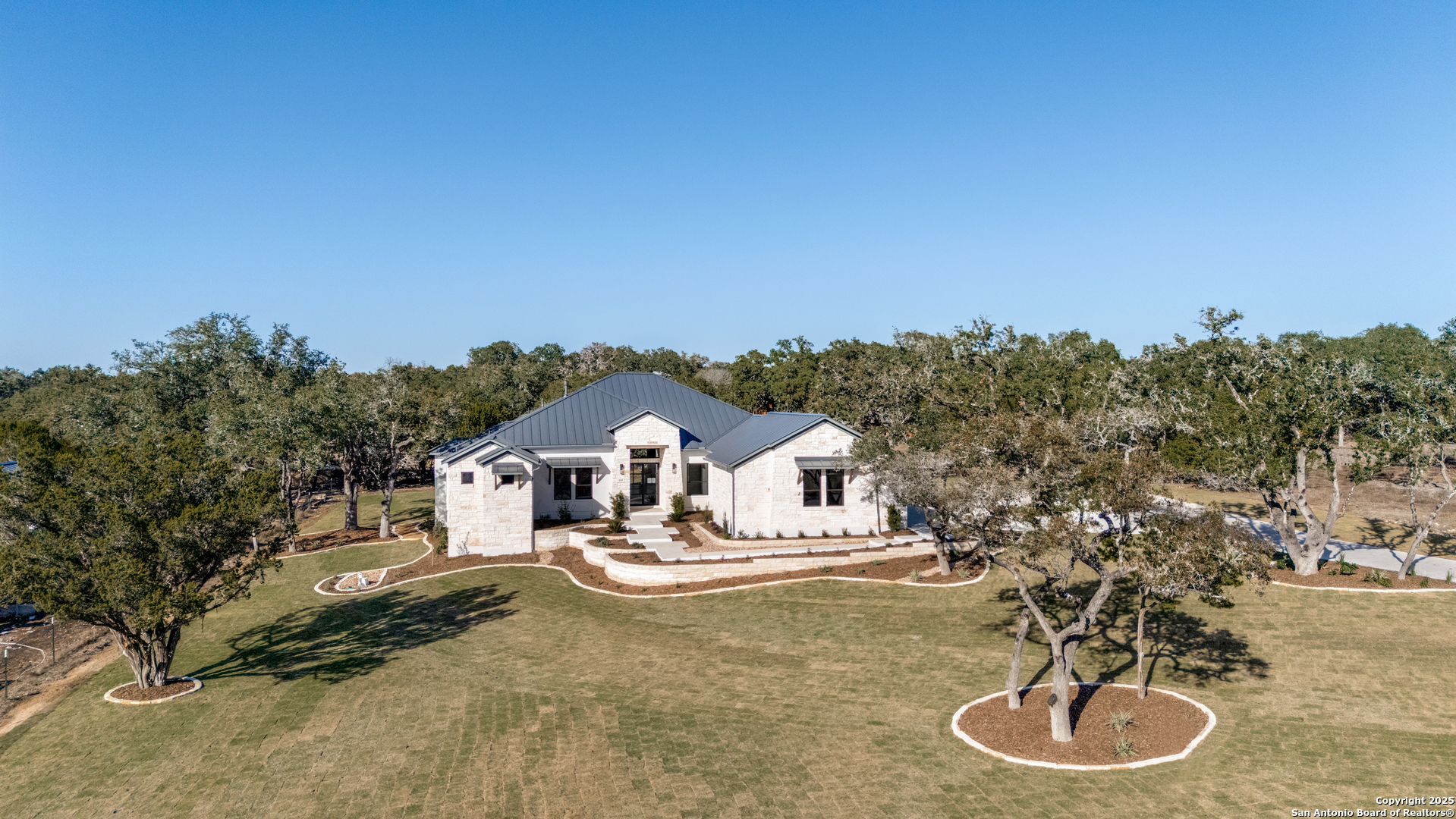 193 Ranch Heights Boerne, TX 78015 - Photo 29 of 29 a white house with a tree in the background