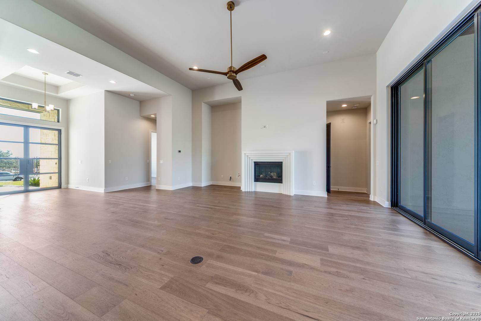 193 Ranch Heights Boerne, TX 78015 - Photo 4 of 29 a view of an empty room with window and wooden floor
