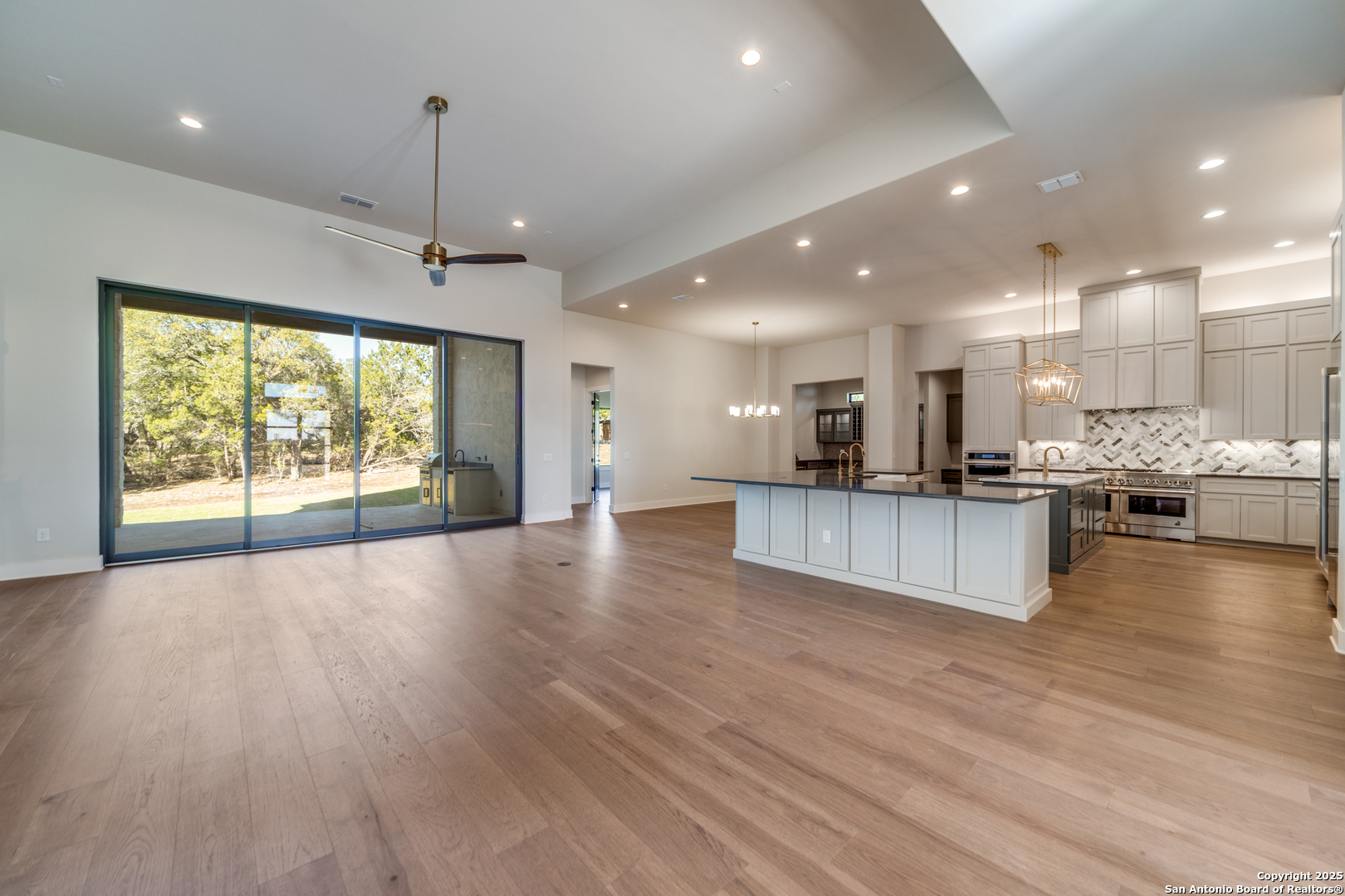 193 Ranch Heights Boerne, TX 78015 - Photo 6 of 29 a view of kitchen with kitchen island stainless steel appliances refrigerator oven and chairs
