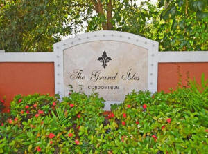 4159 Haverhill Road, Unit 1307 West Palm Beach, FL 33417 - Photo 14 of 14 a sign that is in front of flowers