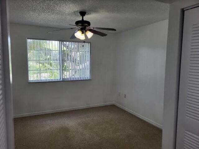 4159 Haverhill Road, Unit 1307 West Palm Beach, FL 33417 - Photo 5 of 14 an empty room with a window