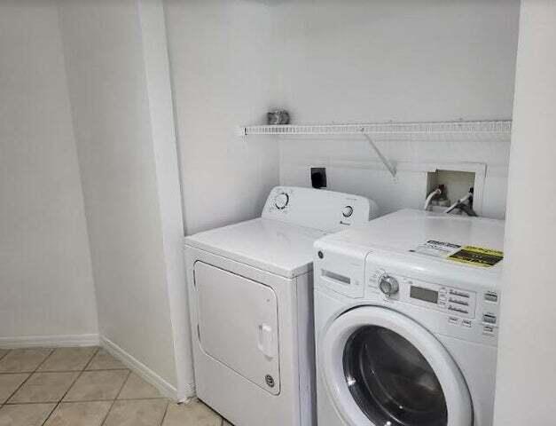 4159 Haverhill Road, Unit 1307 West Palm Beach, FL 33417 - Photo 9 of 14 a utility room with dryer and washer