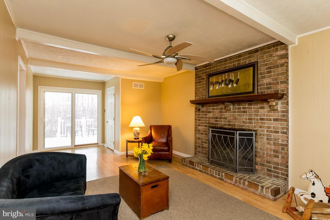 288 East Padonia Road Cockeysville, MD 21030 - Photo 14 of 30 Fireplace in family room with doors to deck.