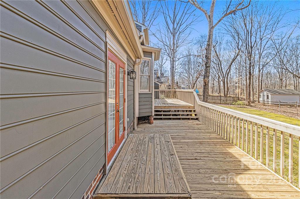 5130 Panhandle Circle Matthews, NC 28104 - Photo 18 of 20 a view of a balcony with wooden floor and fence