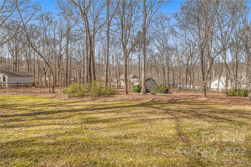 5130 Panhandle Circle Matthews, NC 28104 - Photo 20 of 20 a view of a swimming pool with a house