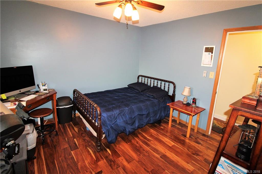 1930 Bobby Ray Road, Unit 10 Clover, SC 29710 - Photo 15 of 24 a bedroom with a bed and wooden floor