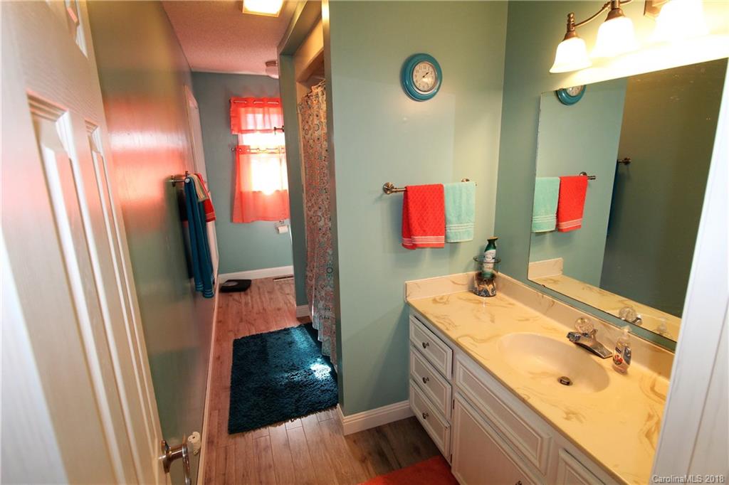 1930 Bobby Ray Road, Unit 10 Clover, SC 29710 - Photo 16 of 24 a bathroom with a sink vanity and mirror