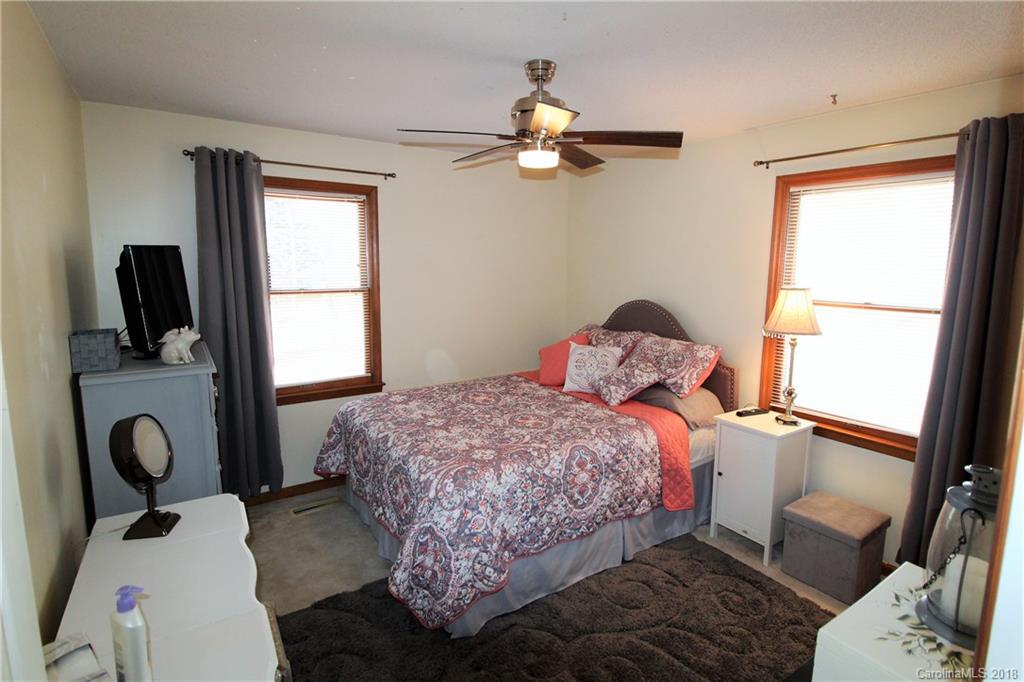 1930 Bobby Ray Road, Unit 10 Clover, SC 29710 - Photo 17 of 24 a bedroom with a bed and wooden floor