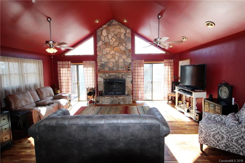 1930 Bobby Ray Road, Unit 10 Clover, SC 29710 - Photo 3 of 24 a living room with furniture a fireplace and a flat screen tv