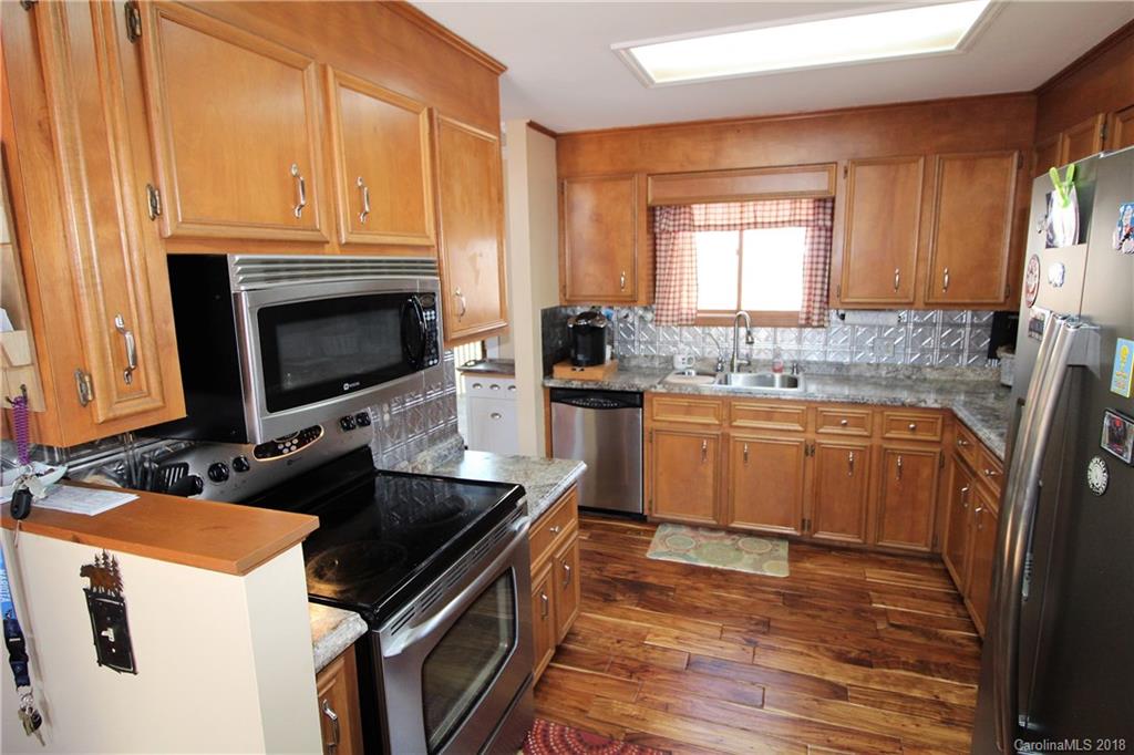 1930 Bobby Ray Road, Unit 10 Clover, SC 29710 - Photo 8 of 24 a kitchen with a sink stove and microwave