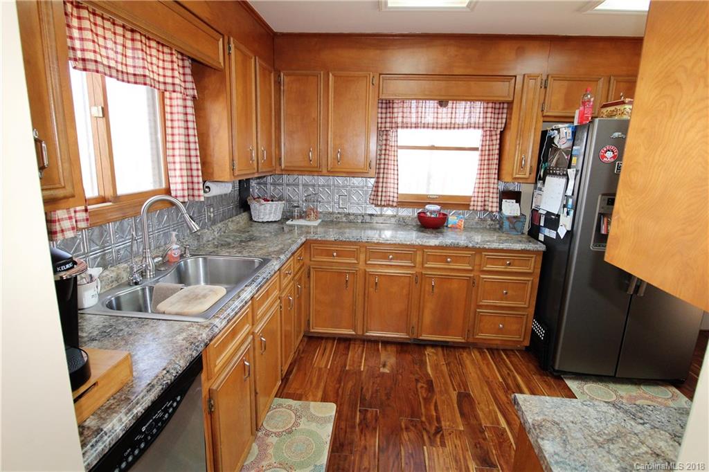 1930 Bobby Ray Road, Unit 10 Clover, SC 29710 - Photo 9 of 24 a kitchen with wooden floors and sink
