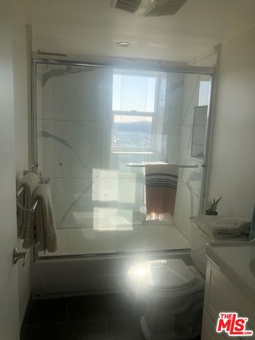 a balcony with an outdoor seating