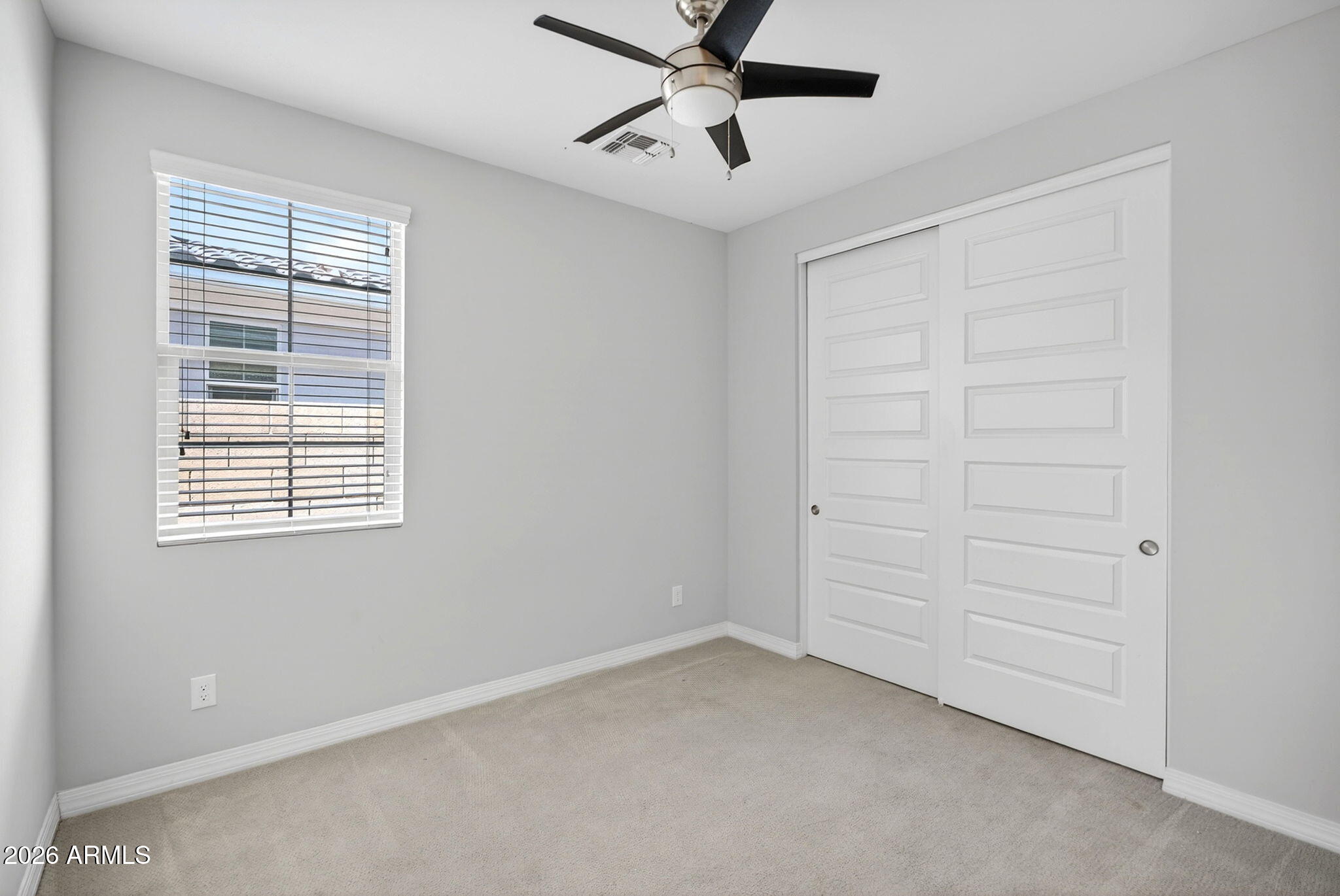 12124 West Peak View Road Peoria, AZ 85383 - Photo 27 of 38 a view of an empty room with a window