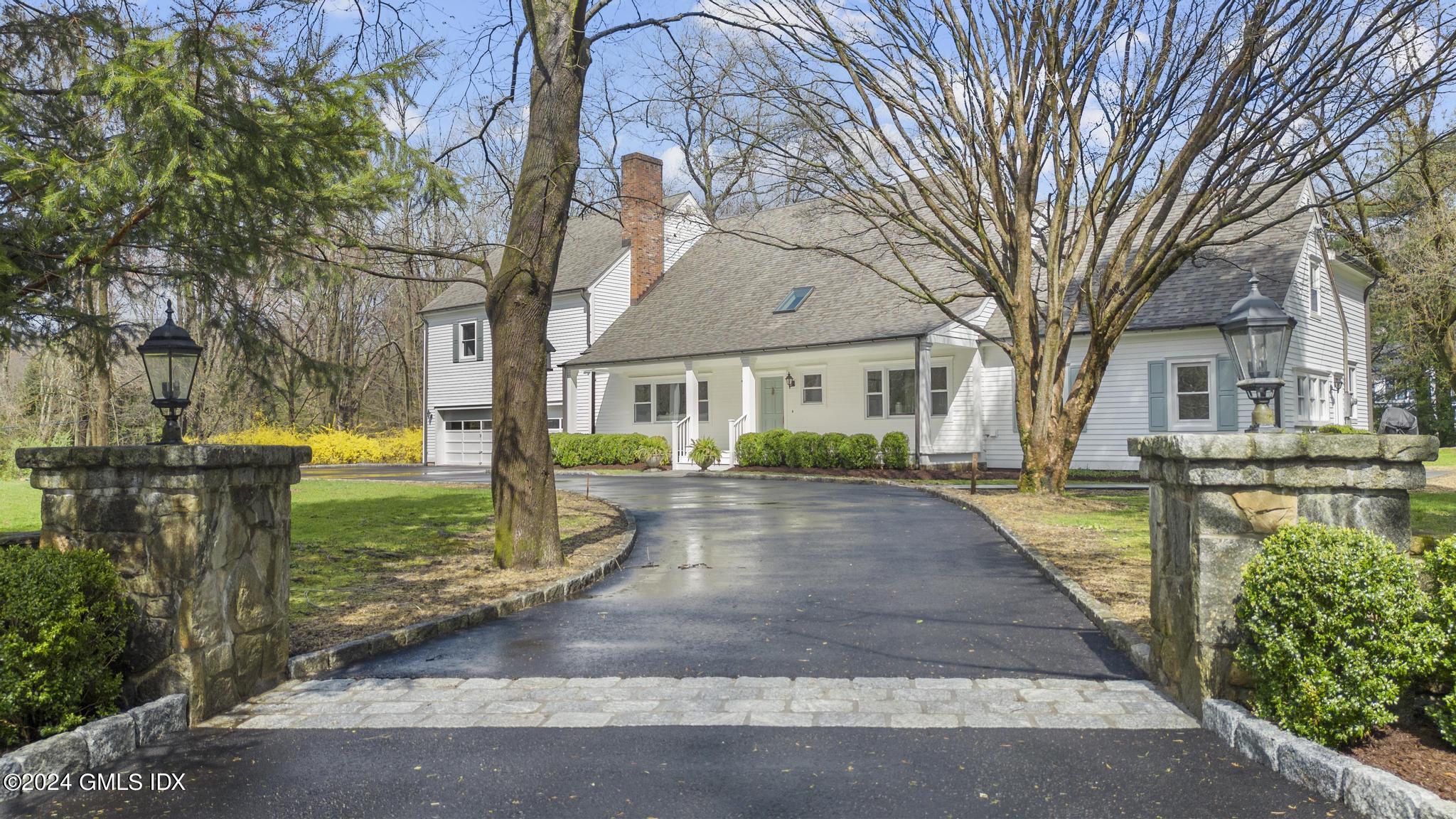 311 Cognewaugh Road Cos Cob, CT 06807 - Photo 1 of 28 a view of a yard in front of house
