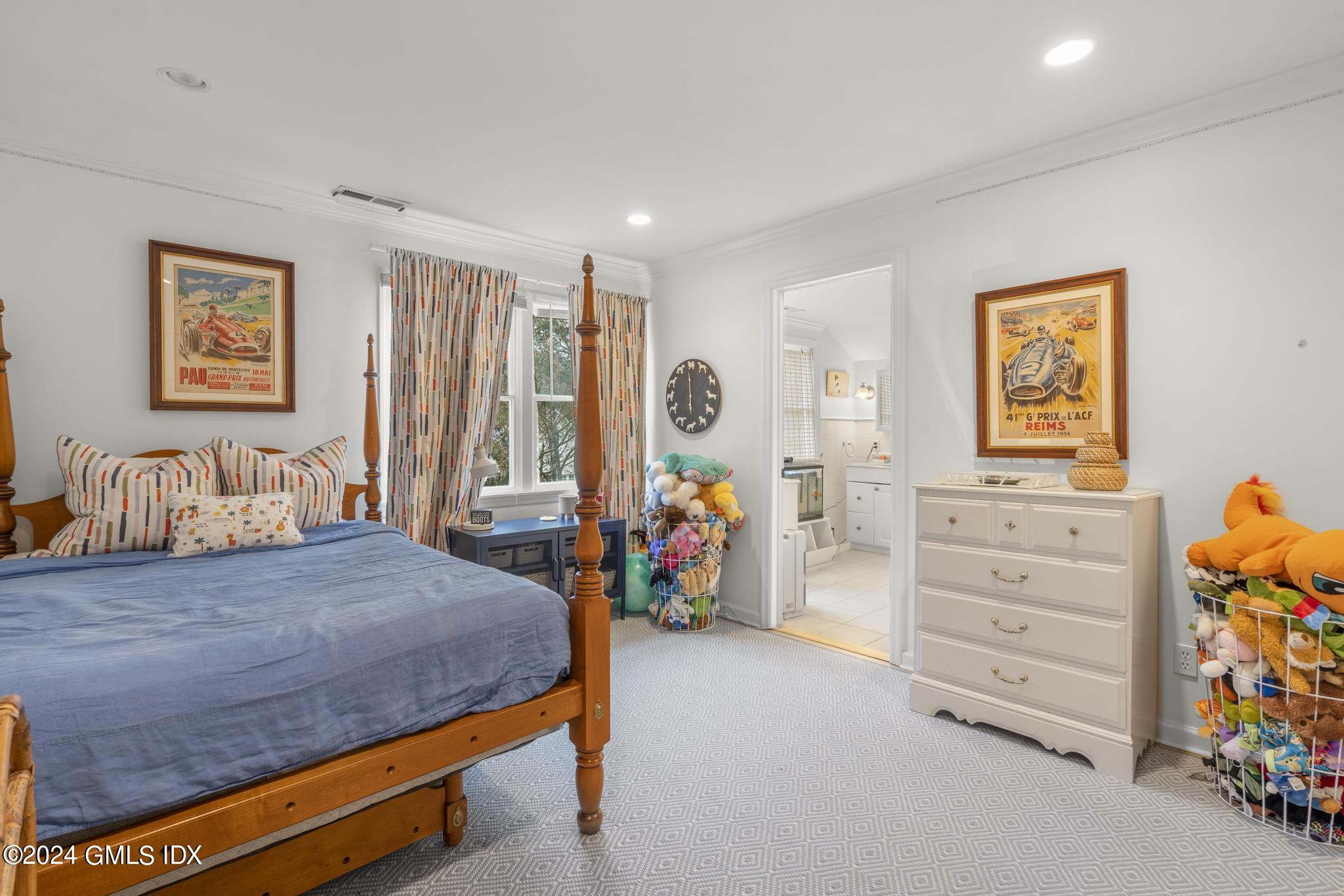 311 Cognewaugh Road Cos Cob, CT 06807 - Photo 14 of 28 a bedroom with a bed and furniture