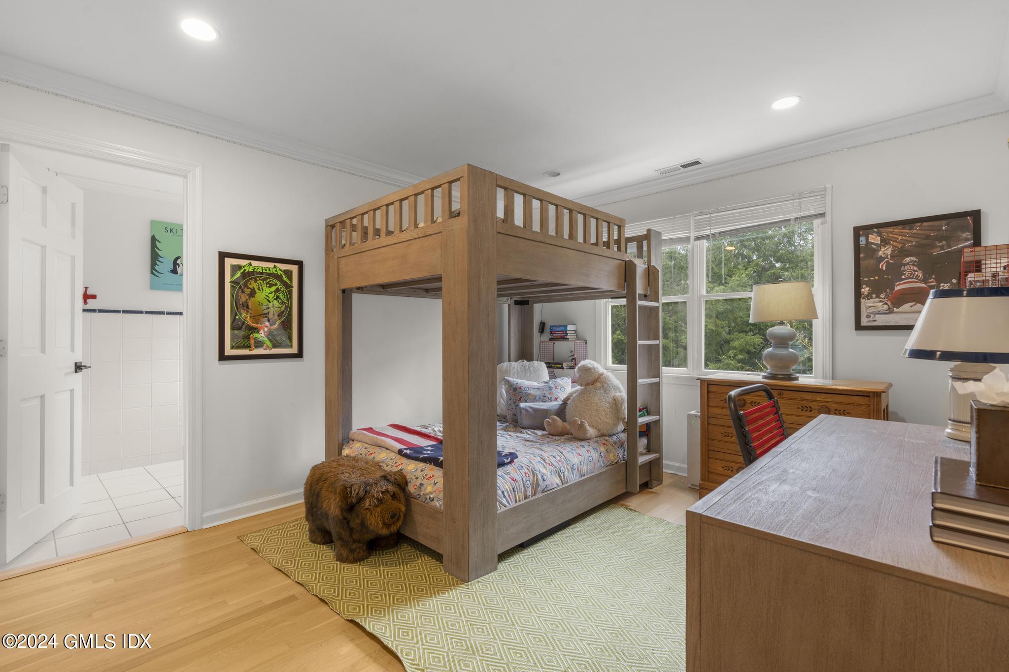 311 Cognewaugh Road Cos Cob, CT 06807 - Photo 15 of 28 a bedroom with bed and glass door