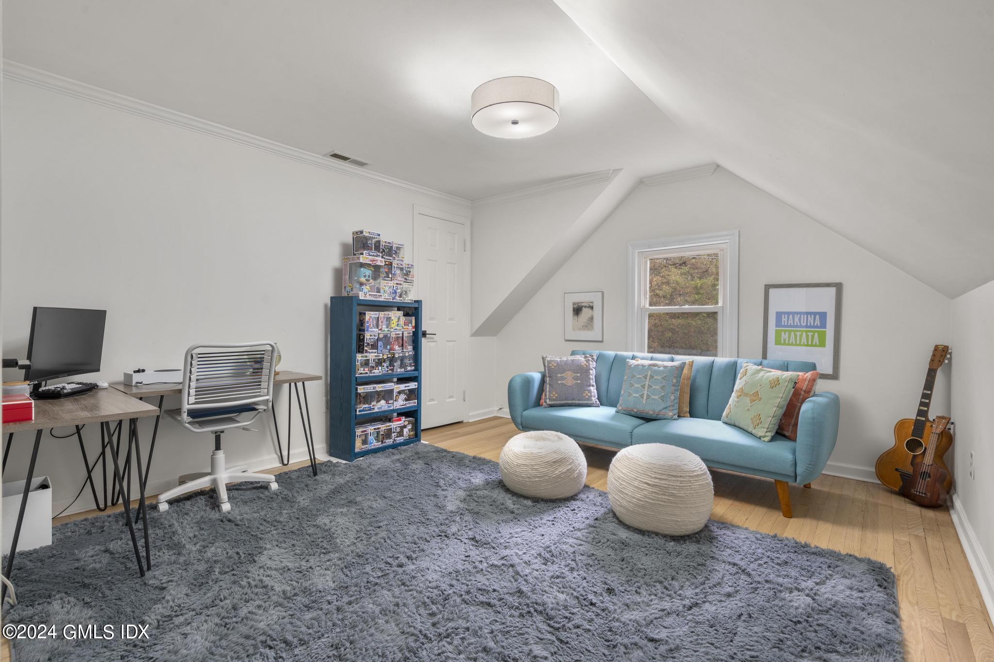 311 Cognewaugh Road Cos Cob, CT 06807 - Photo 17 of 28 a living room with furniture and a flat screen tv