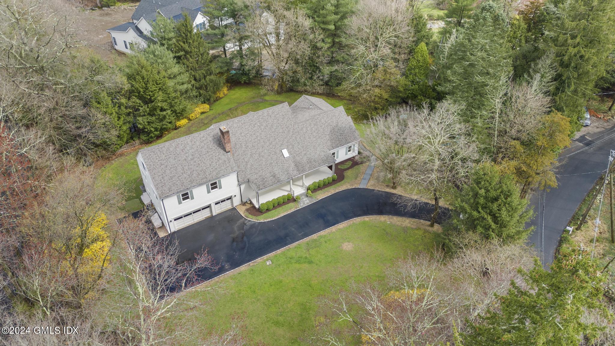 311 Cognewaugh Road Cos Cob, CT 06807 - Photo 23 of 28 an aerial view of a house with a yard