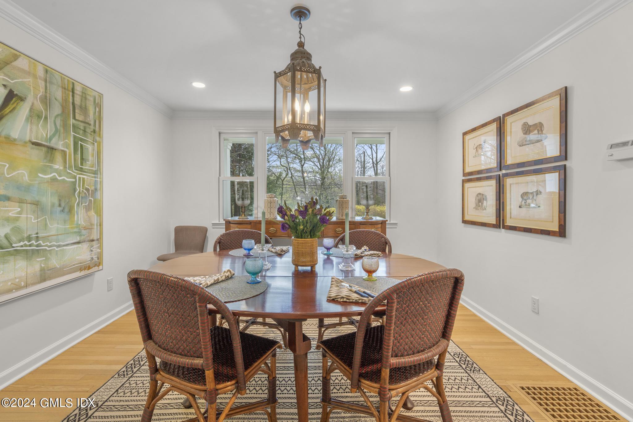 311 Cognewaugh Road Cos Cob, CT 06807 - Photo 4 of 28 a view of a dining room with furniture window and outside view