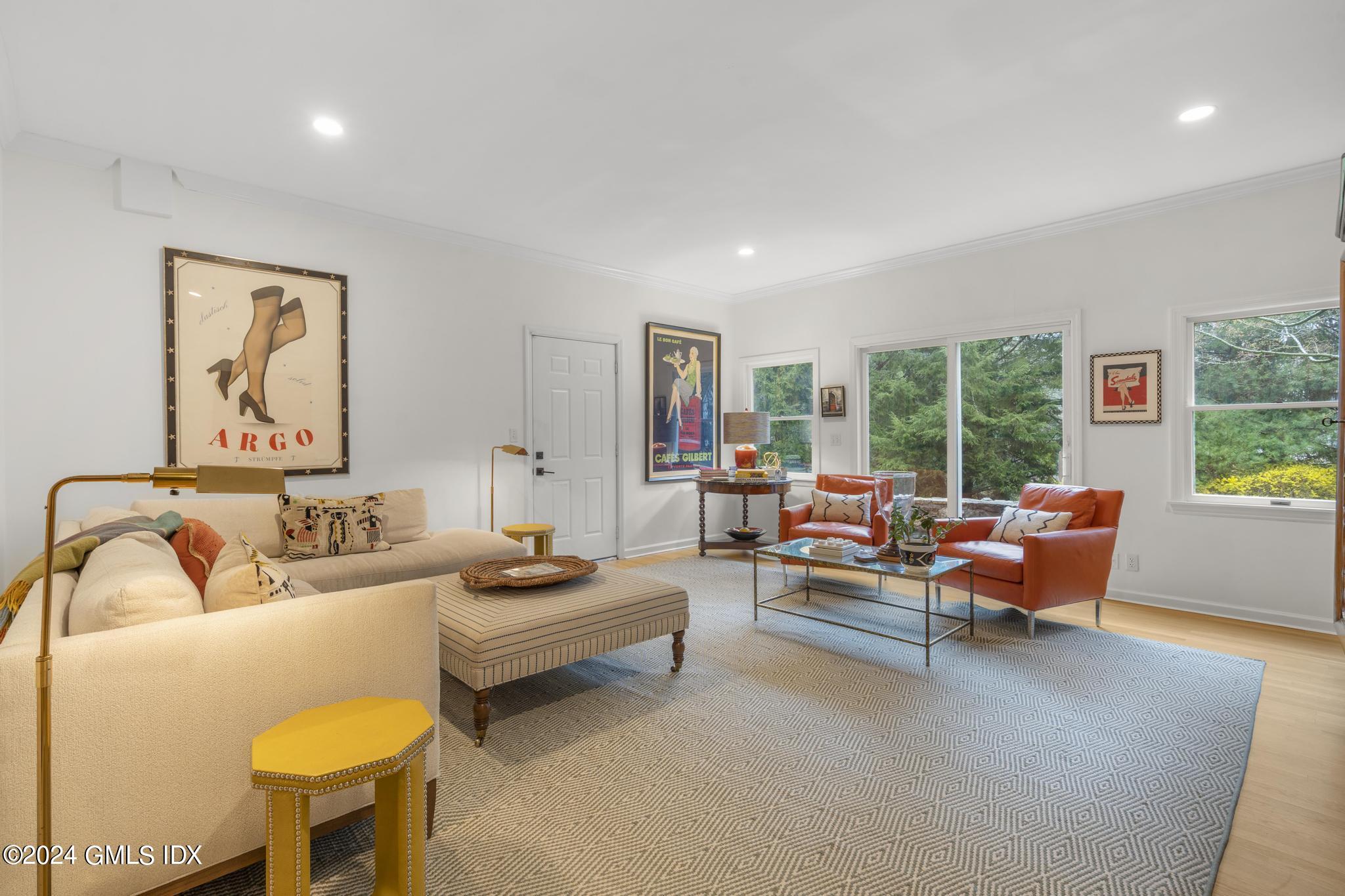311 Cognewaugh Road Cos Cob, CT 06807 - Photo 5 of 28 a living room with furniture and a large window