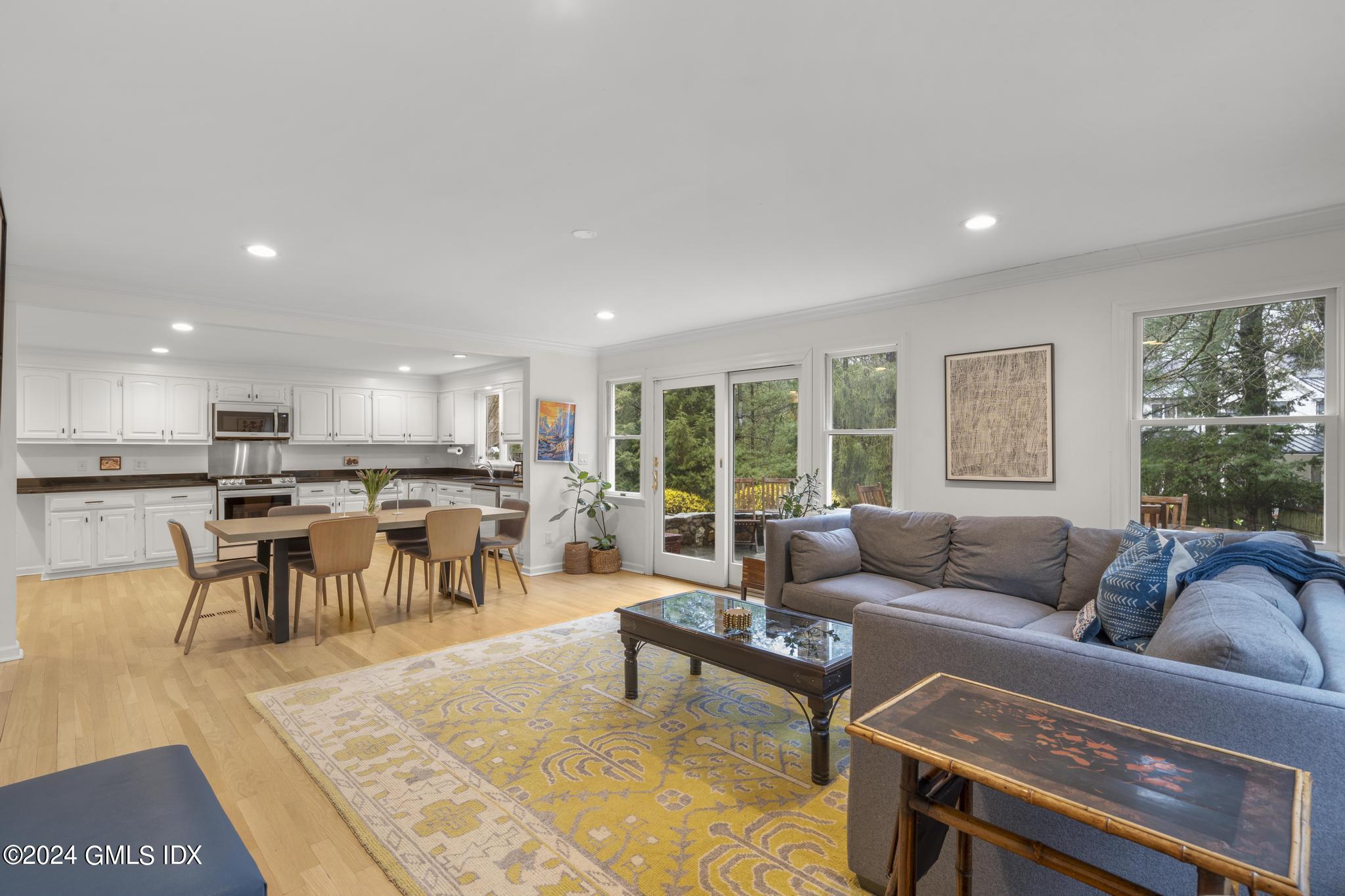 311 Cognewaugh Road Cos Cob, CT 06807 - Photo 7 of 28 a living room with furniture kitchen view and a large window