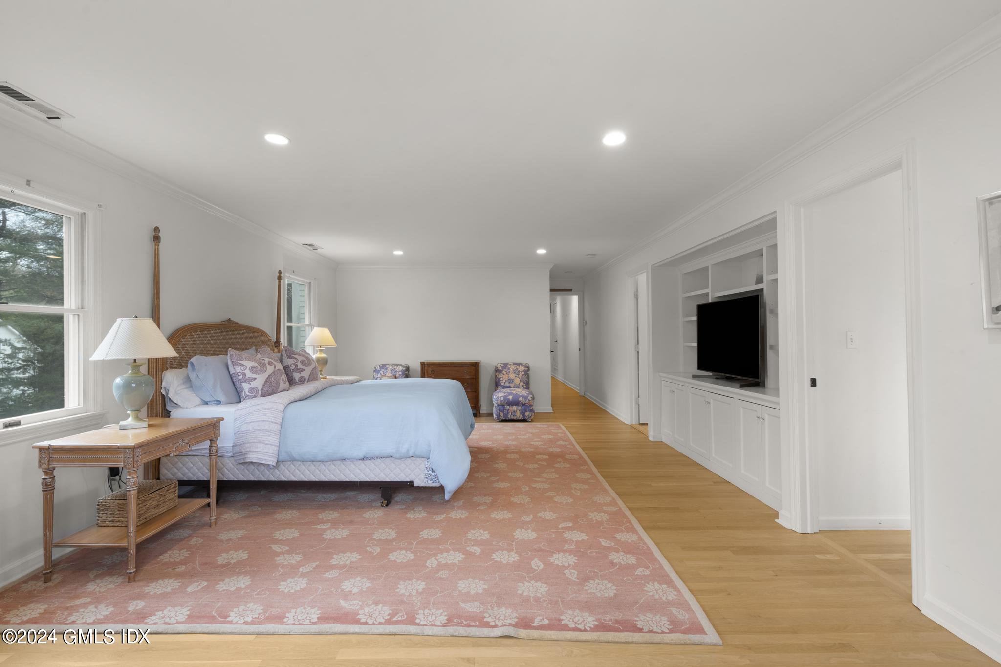 311 Cognewaugh Road Cos Cob, CT 06807 - Photo 10 of 28 a living room with furniture and a flat screen tv