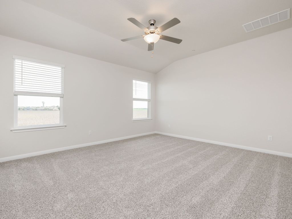 105 Texas Agate Drive, Unit 5 Kyle, TX 78640 - Photo 12 of 19 an empty room with a window and a ceiling fan