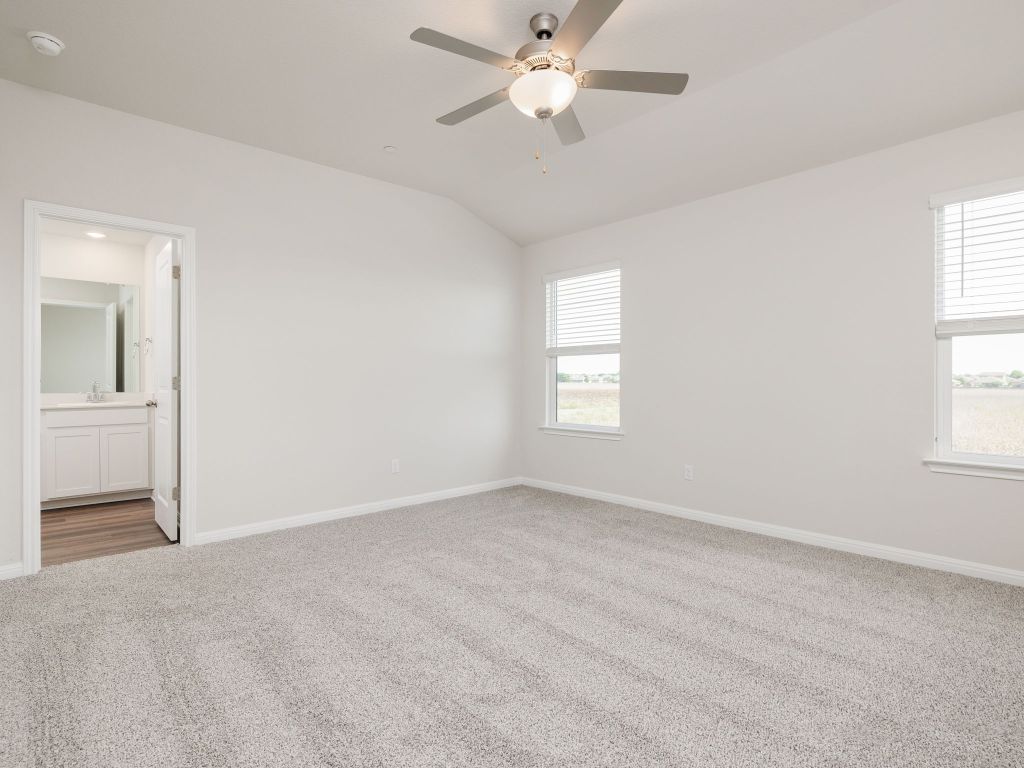 105 Texas Agate Drive, Unit 5 Kyle, TX 78640 - Photo 13 of 19 a view of an empty room with a window