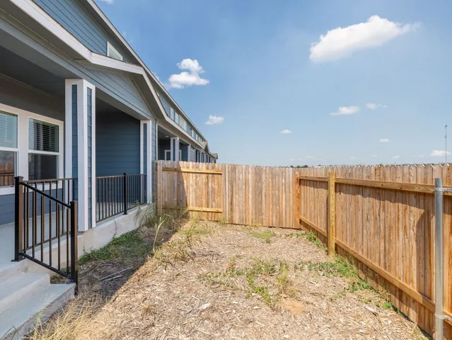 a view of a house with wooden floor in front of house