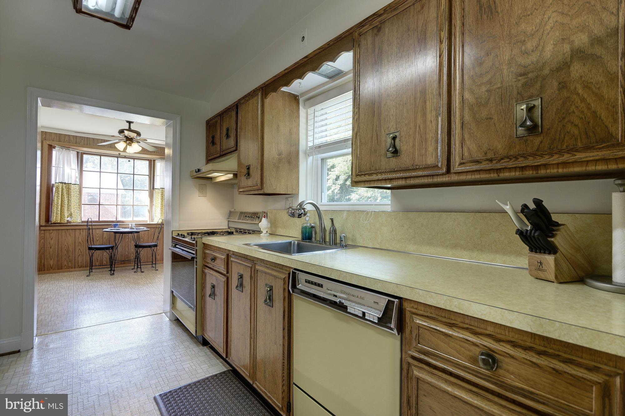11004 Bucknell Drive Silver Spring, MD 20902 - Photo 13 of 30 a kitchen with a sink and cabinets
