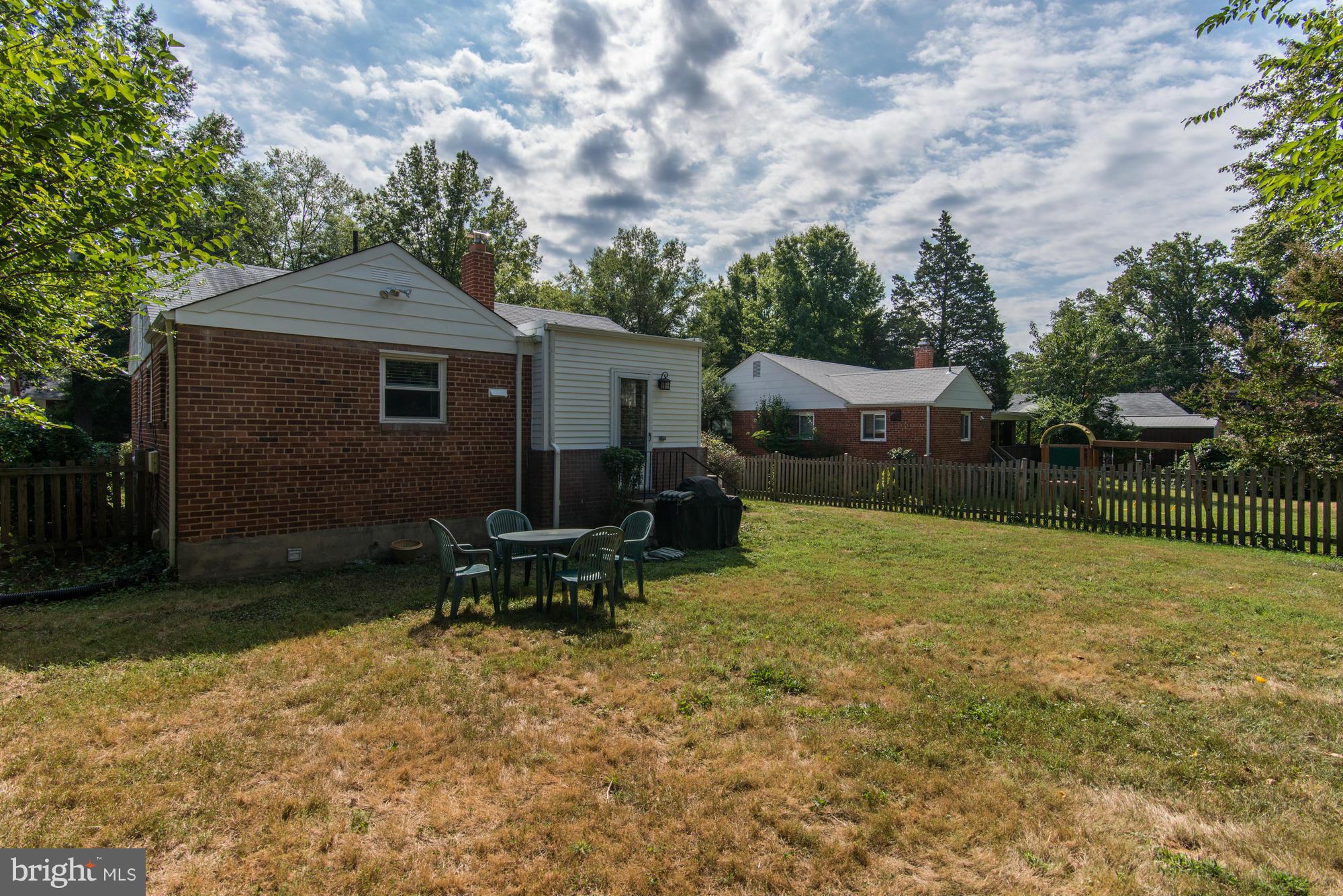 11004 Bucknell Drive Silver Spring, MD 20902 - Photo 30 of 30 a backyard of a house with table and chairs