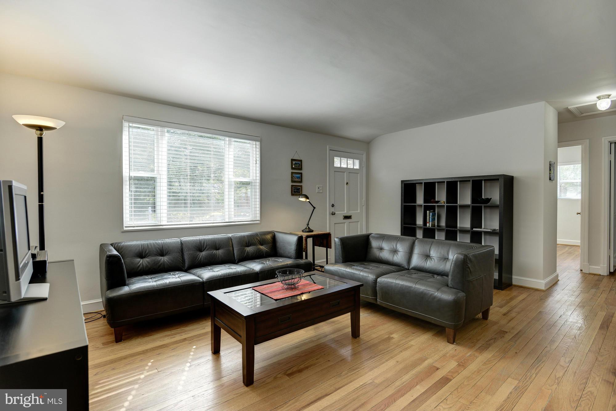 11004 Bucknell Drive Silver Spring, MD 20902 - Photo 4 of 30 a living room with furniture and a window