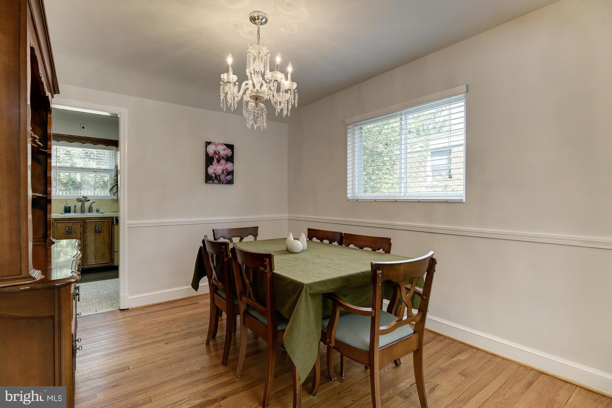 11004 Bucknell Drive Silver Spring, MD 20902 - Photo 7 of 30 a view of a dining room with furniture wooden floor and chandelier