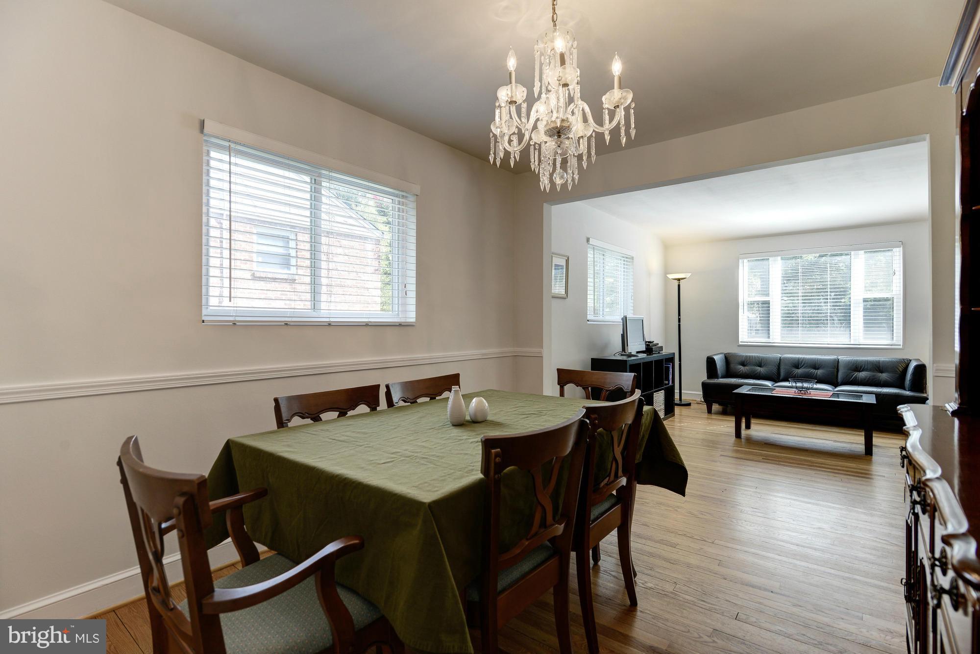 11004 Bucknell Drive Silver Spring, MD 20902 - Photo 9 of 30 a view of a dining room with furniture and wooden floor