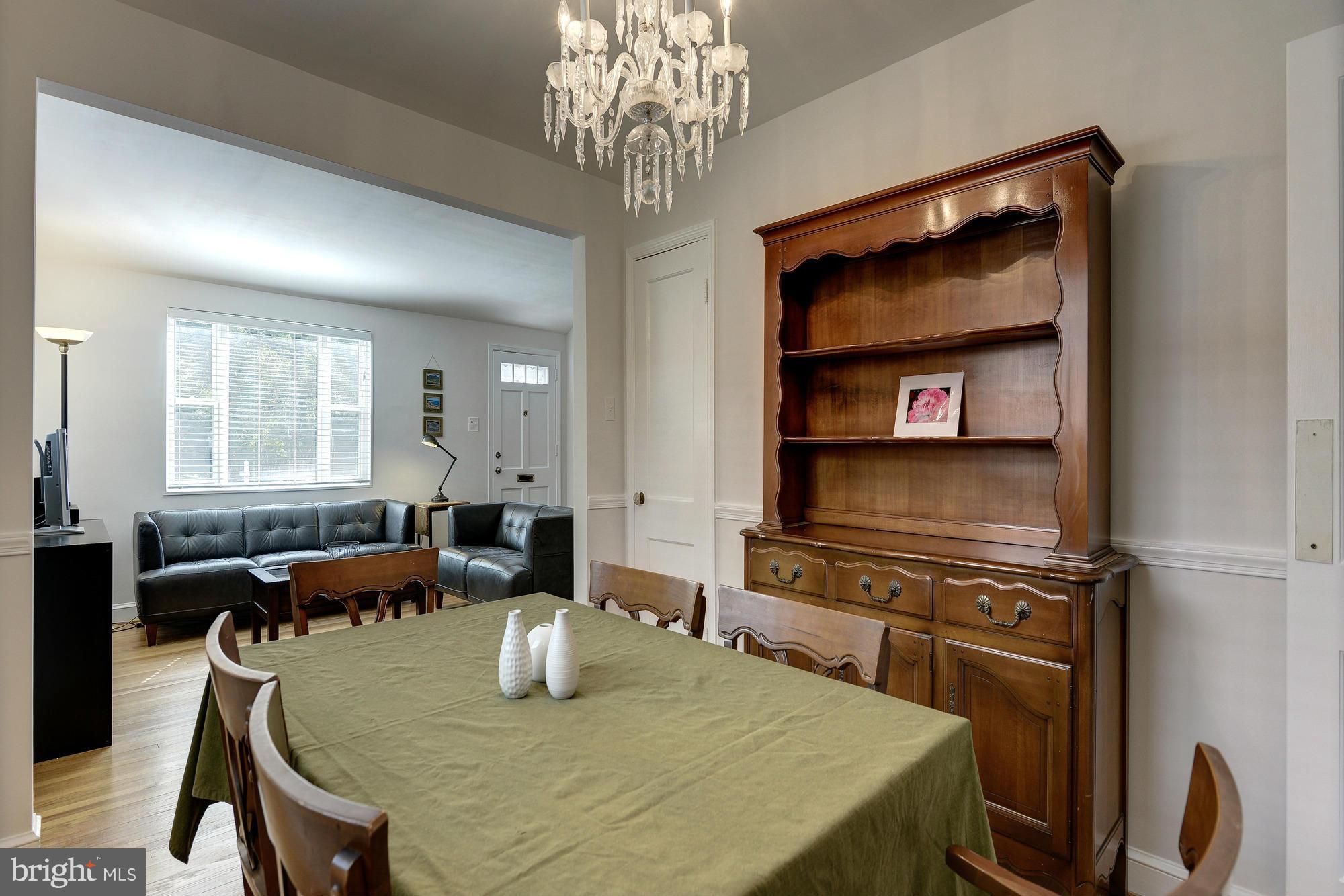 11004 Bucknell Drive Silver Spring, MD 20902 - Photo 10 of 30 a living room with furniture and a flat screen tv