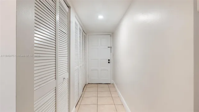 a view of entryway and hall with a window