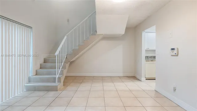 a view of an entryway with stairs