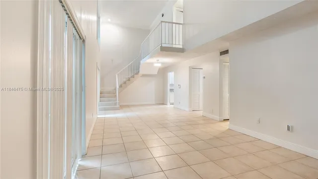 an empty room with white walls