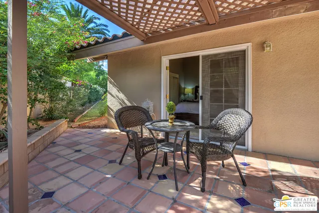 a bedroom with bed and a night stand