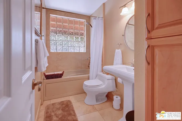 a view of a lake with a yard and a trees