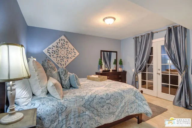 a view of a patio with a table and chairs