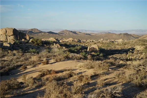 a view of mountain view with mountains in the background