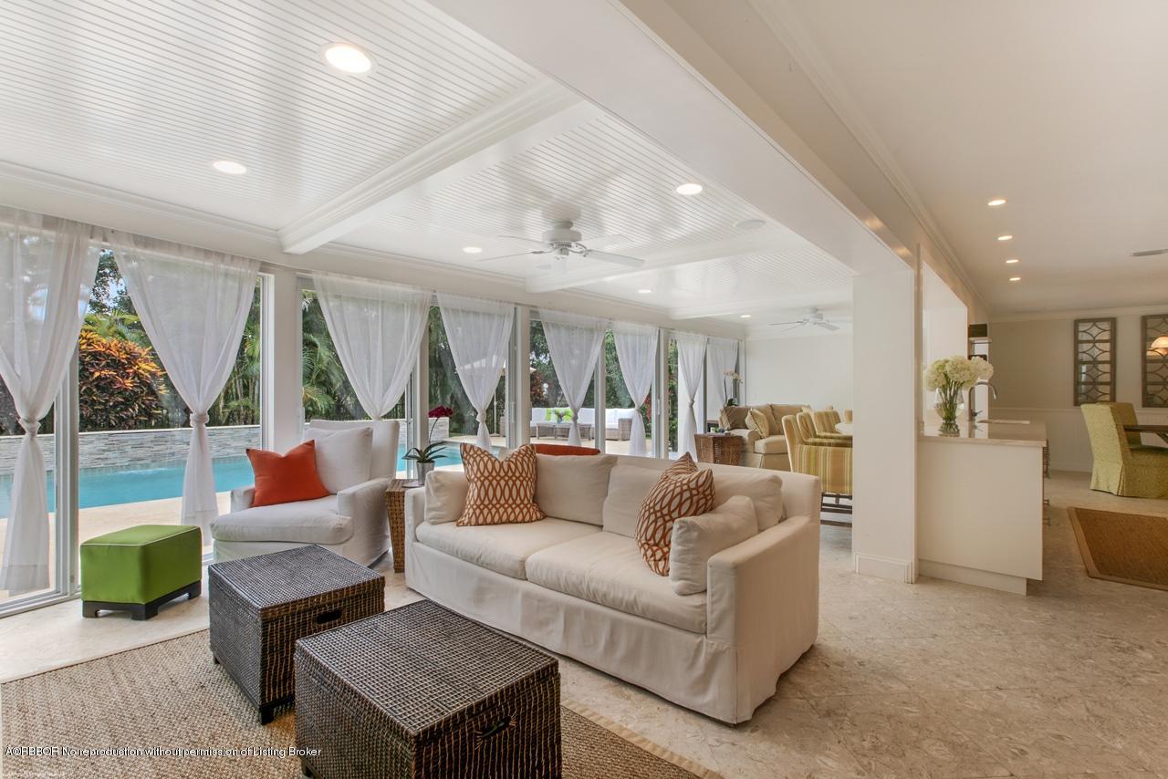 11 Ridge Boulevard Ocean Ridge, FL 33435 - Photo 10 of 26 a living room with furniture and a large window